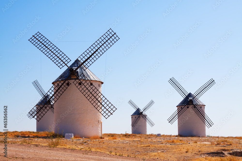 Group of retro windmills in field