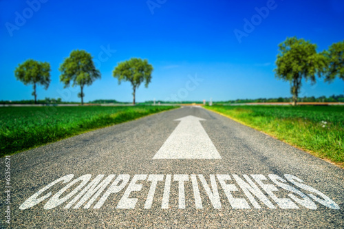 Competitiveness word painted on asphalt road