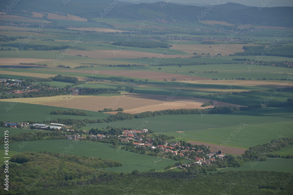 Obraz premium View of trees, mountains, hills, fields and villages from Marhat
