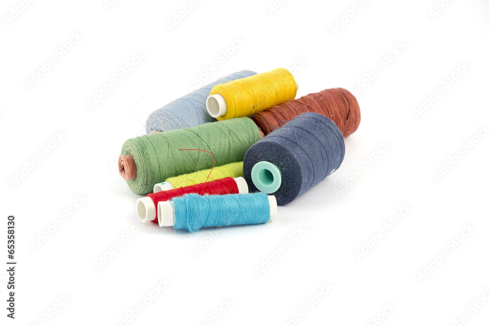 Colorful thread lie on a white background Colorful thread lie on a white background