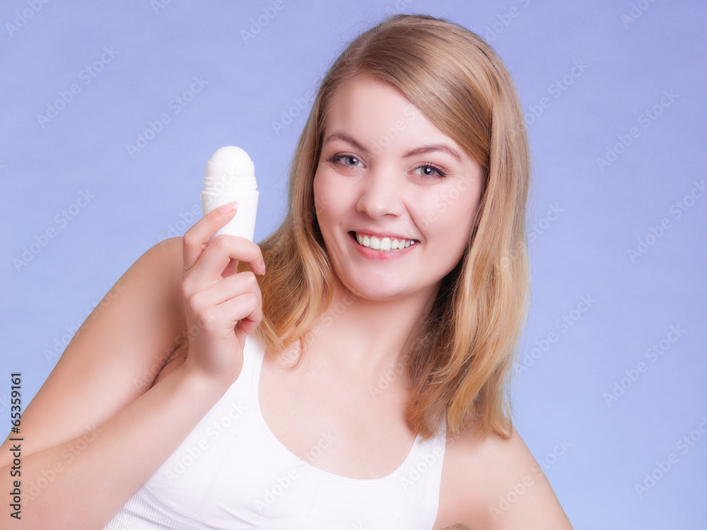 Girl applying stick deodorant in armpit. Skin care Girl applying stick deodorant in armpit. Skin care