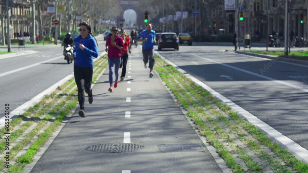 People jogging on the street, slow motion shot at 120fps, steady People jogging on the street, slow motion shot at 120fps, steady