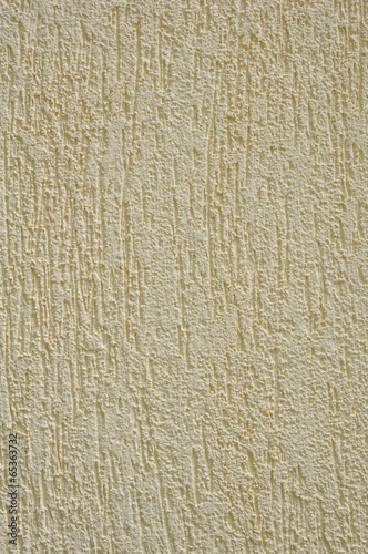 Yellow rough plaster on wall