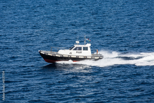 Black and White Pilot Boat on Blue