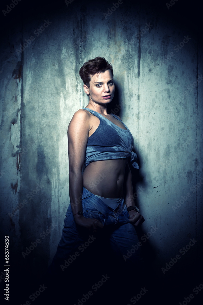 Woman on concrete Wall Background. Woman on concrete Wall Background.