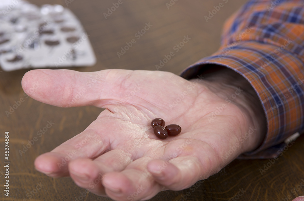 Obraz premium Pills in palm