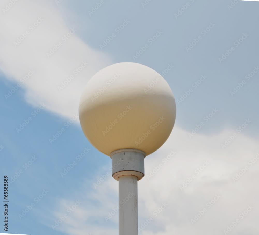 lamppost and white cloud in the blue sky lamppost and white cloud in the blue sky