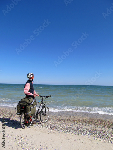Cyclist on the beach. © vetal1983