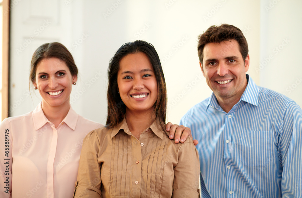 Male and female coworkers smiling at you