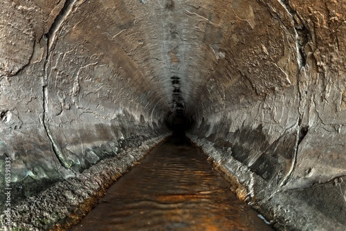 Deep sewage tunnel with poinson flowing