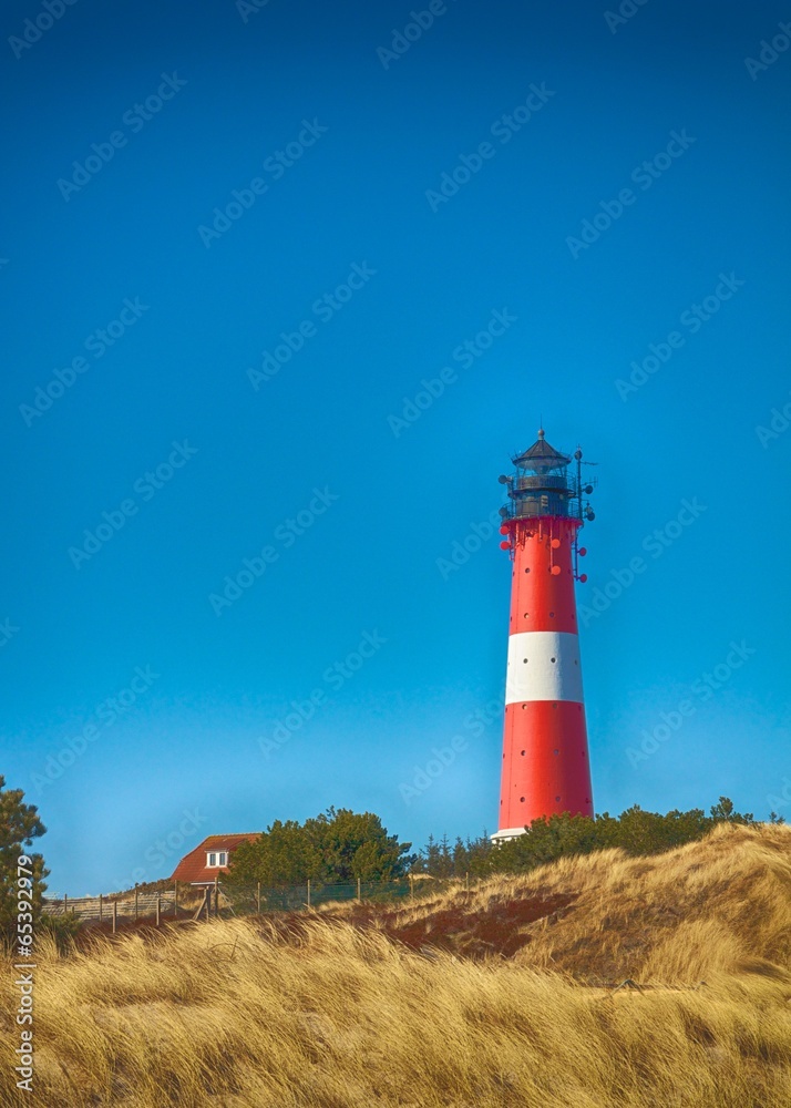 Lighthouse between dunes HDR