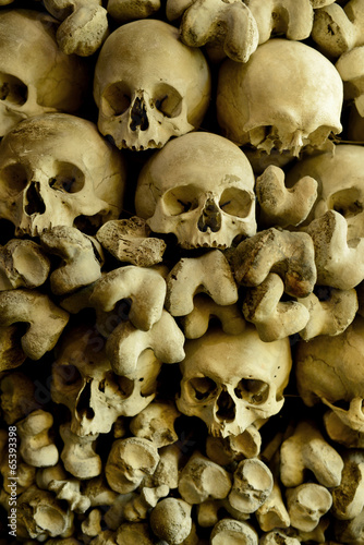 Human skulls and bones in the wall of Skull Chapel in Czermna