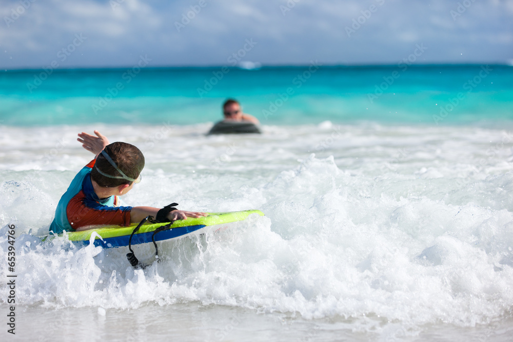 Boy swimming on boogie board