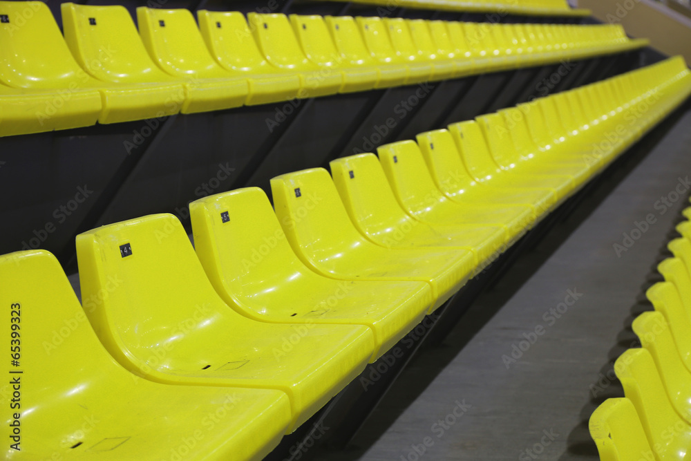 Obraz premium yellow plastic chairs