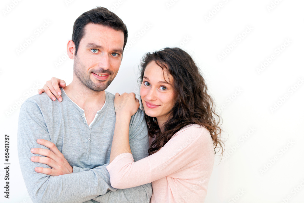Portrait of a young happy couple on a white background