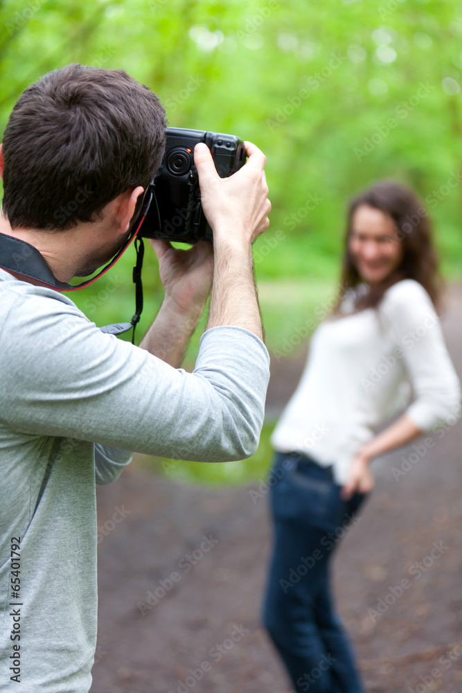 Photographer taking picture of an attractive model Photographer taking picture of an attractive model