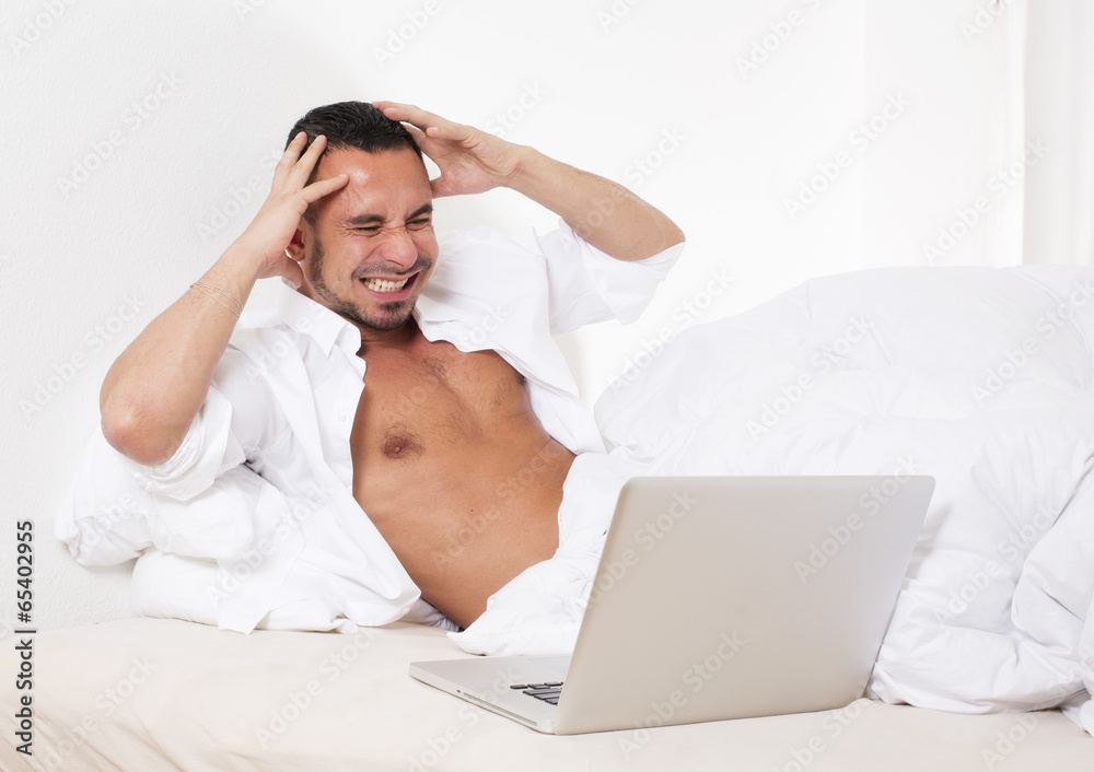 man in bed with laptop man in bed with laptop