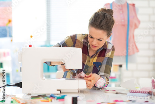 Seamstress sewing in studio