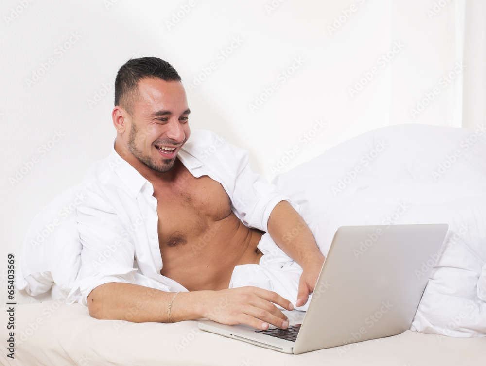 man in bed with laptop man in bed with laptop
