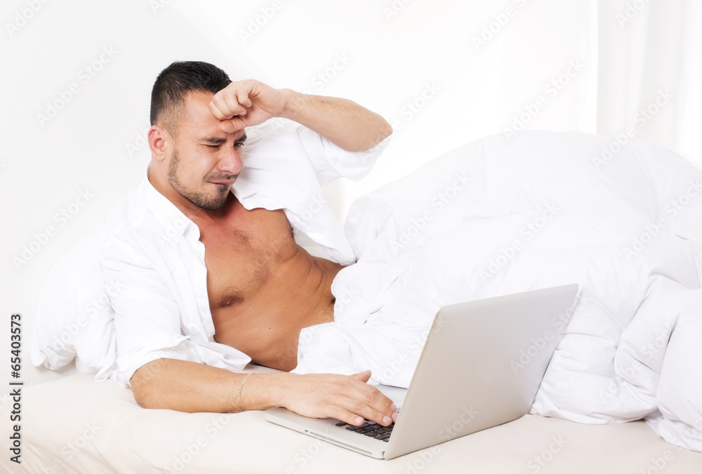 man in bed with laptop man in bed with laptop