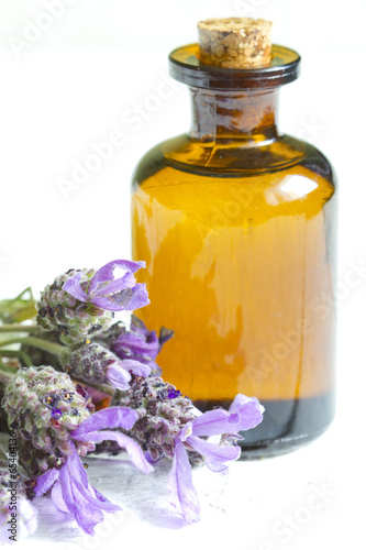 Lavender oil on white planks closeup