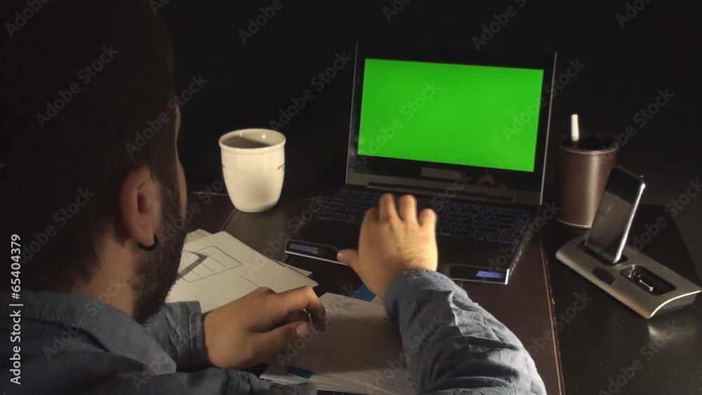 Young Business Man Working With Green Screen Laptop