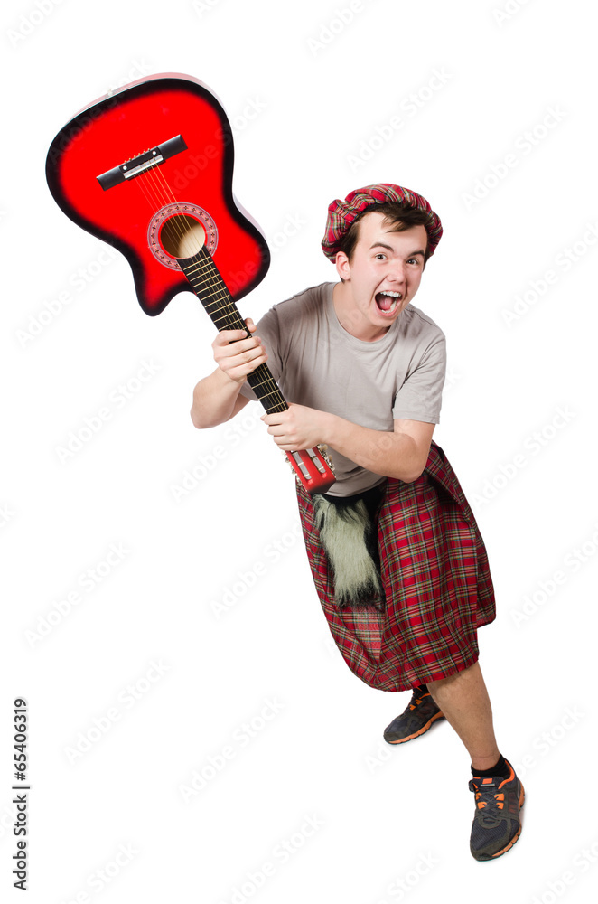 Scotsman playing guitar isolated on white Scotsman playing guitar isolated on white