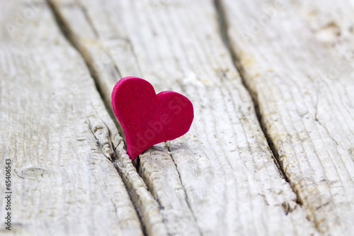 red heart on wooden background