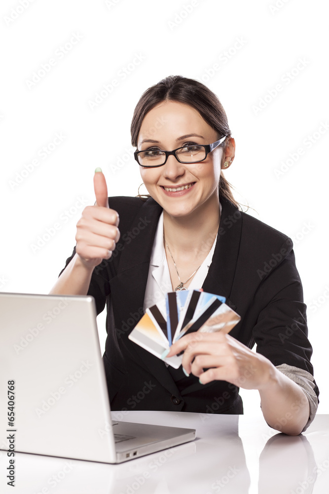Happy Woman shopping online with credit card and laptop Happy Woman shopping online with credit card and laptop