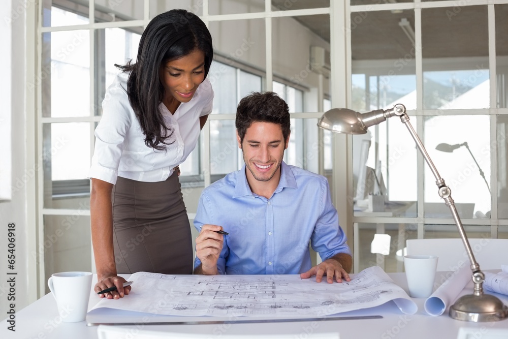 Fototapeta premium Architects working on blueprints