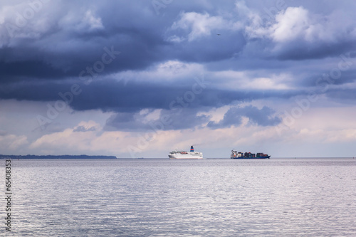 Ferry and container cargo ship on Baltic sea in Poland