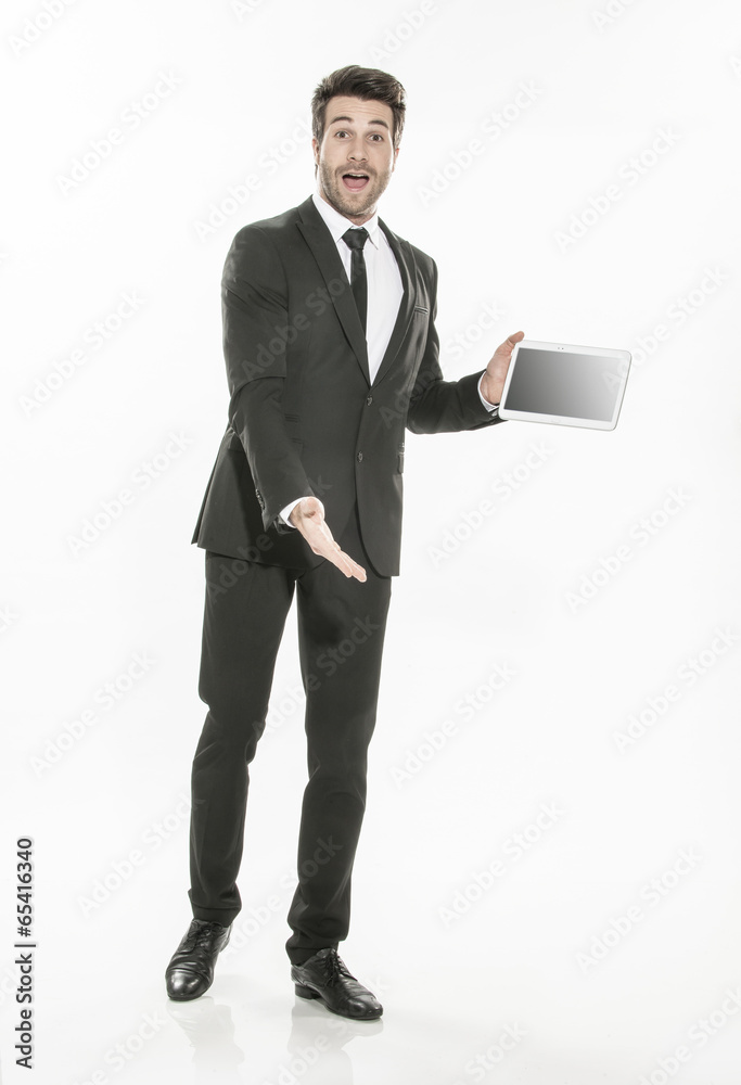 handsome man in a suit presenting a digital tablet with a blank