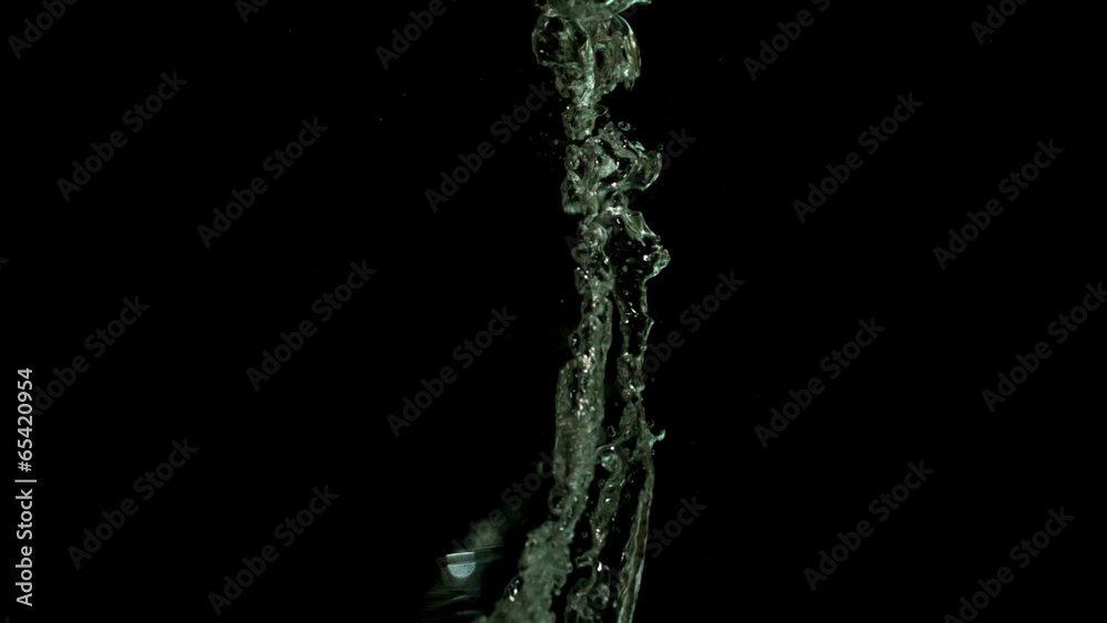 Chili pepper falling in water on black background