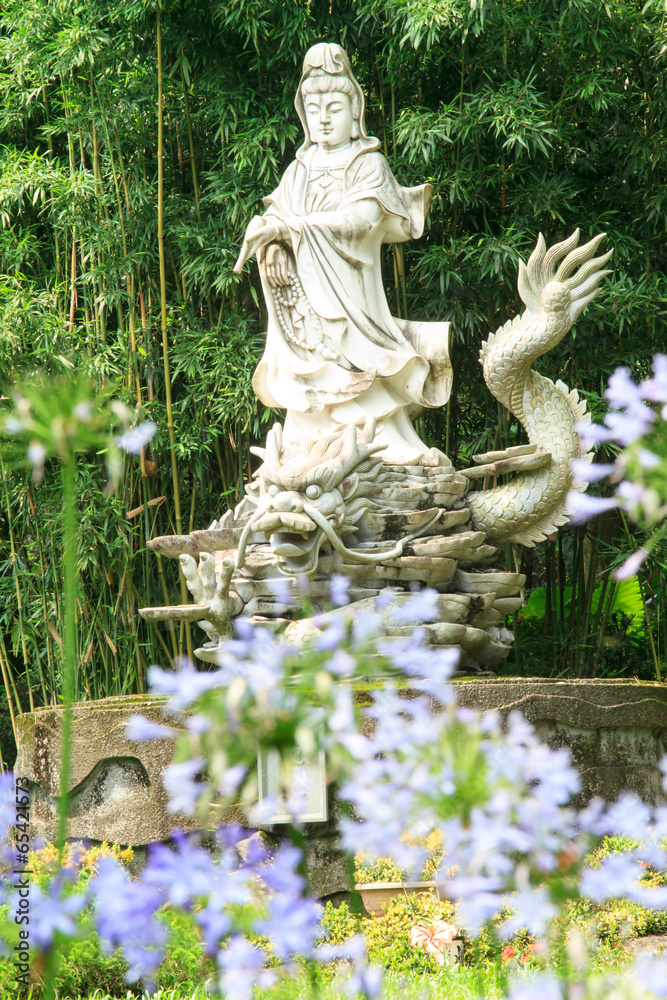 Sculptures of Chinese gods. (Kuan Yin) in the park.