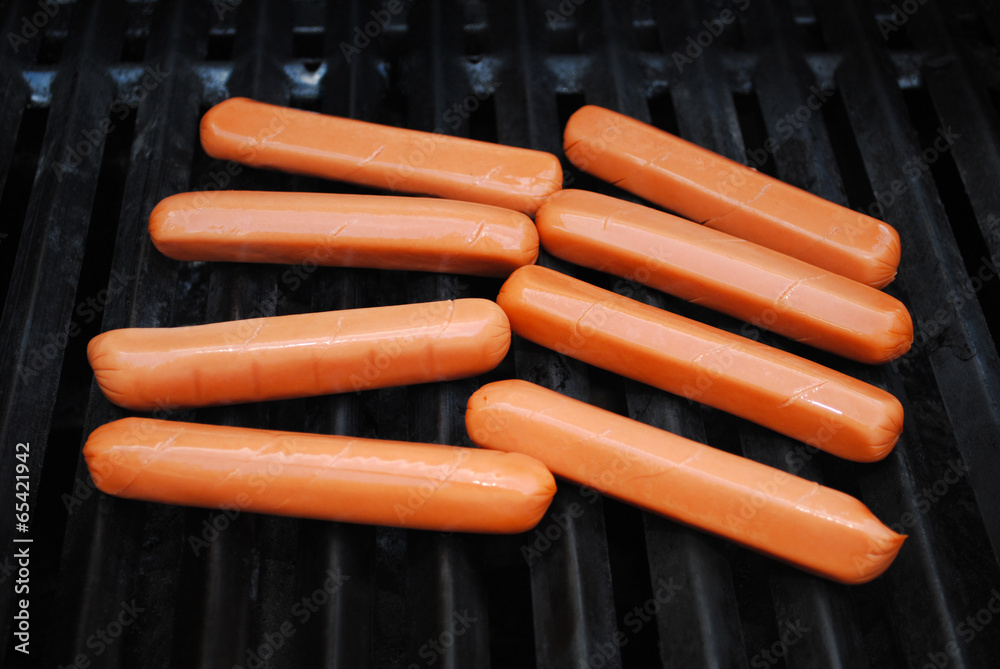Raw Hot Dogs on a Summer Grill Raw Hot Dogs on a Summer Grill