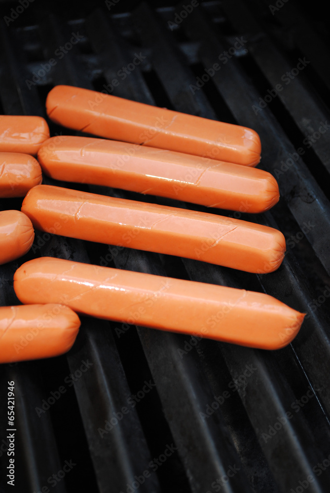 Many Hot Dogs Cooking on a Barbeque Grill Many Hot Dogs Cooking on a Barbeque Grill