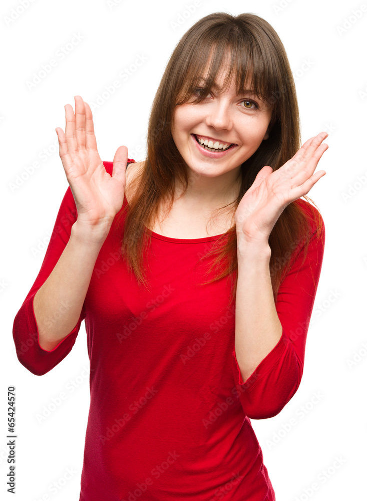 Portrait of a young woman raised her hands up Portrait of a young woman raised her hands up