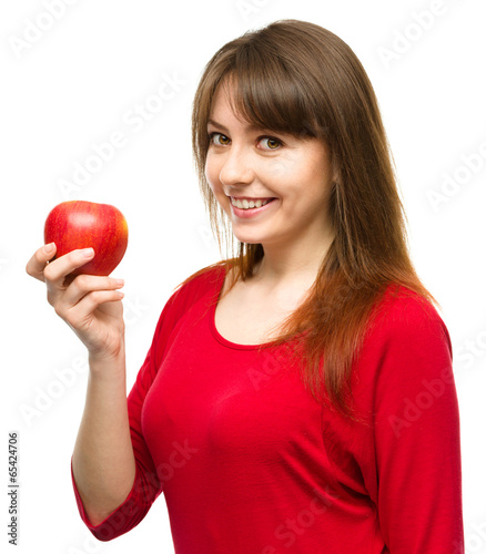 Young happy girl with apple