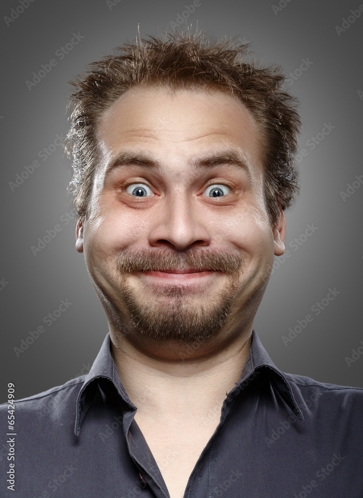 Obraz premium A man with a beard and mustache expression of happiness on her f