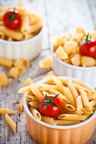 uncooked pasta and cherry tomatoes