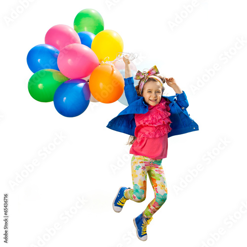 Little girl with balloons jumping