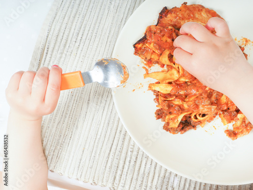 Child and lasagna