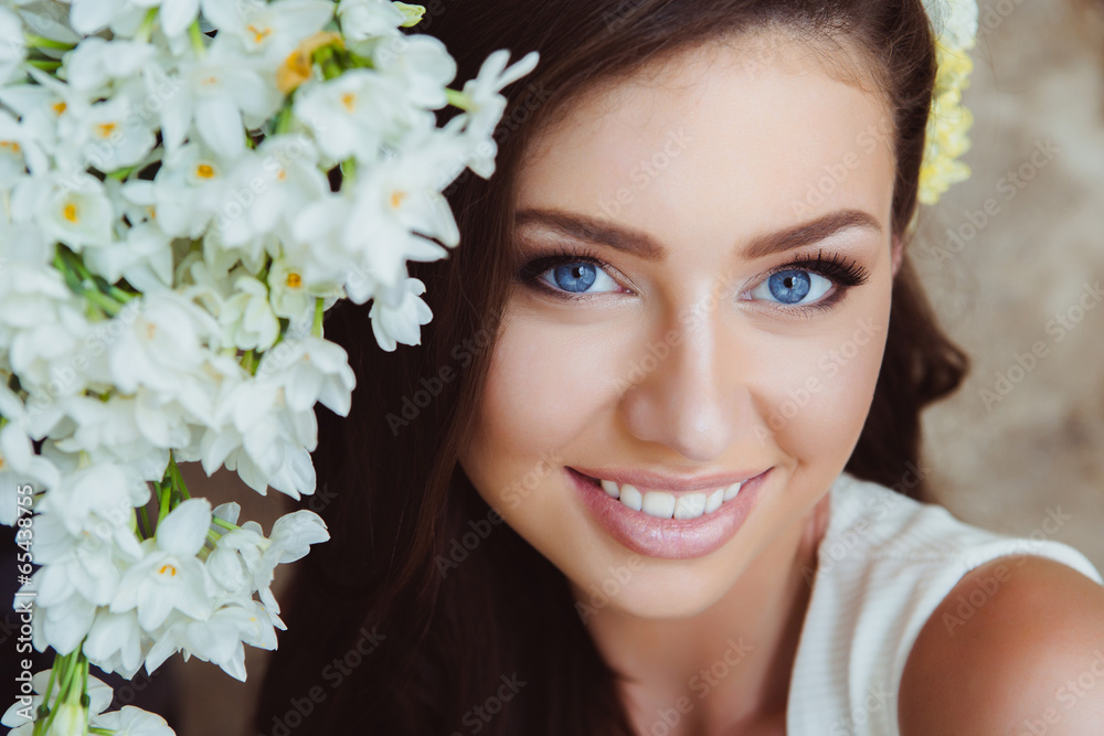 Beautiful Woman in Flowers. Healthy Long Hair and Clean Skin. Beautiful Woman in Flowers. Healthy Long Hair and Clean Skin.