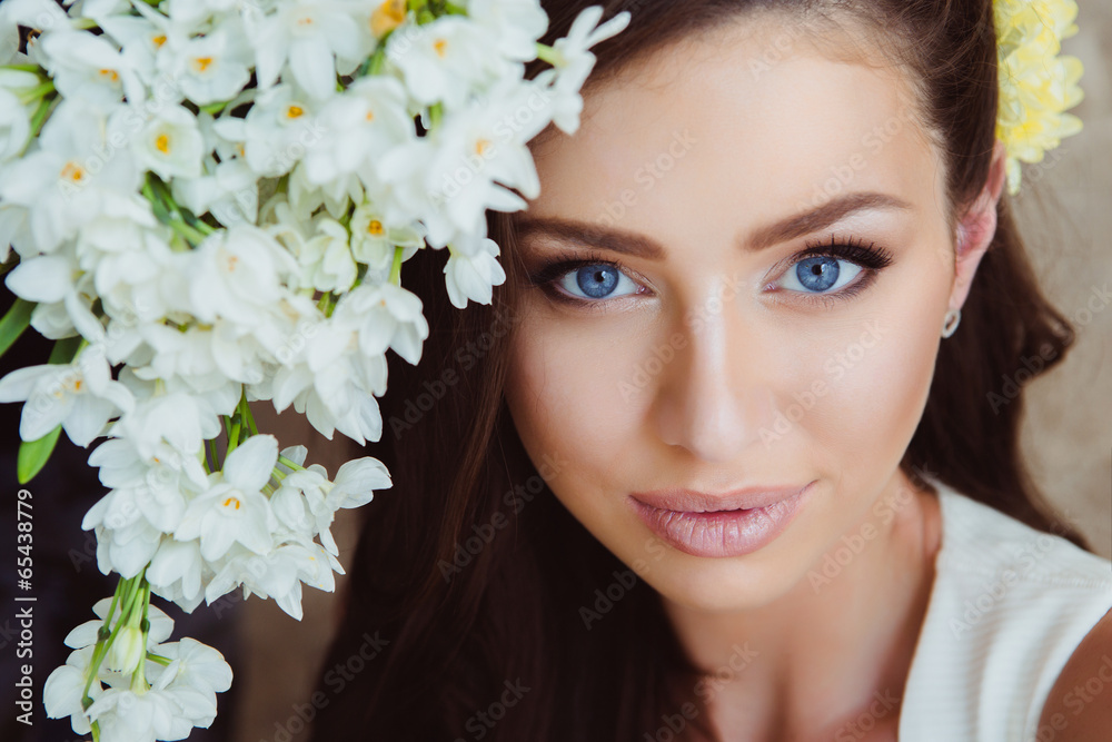 Beautiful Woman in Flowers. Healthy Long Hair and Clean Skin. Beautiful Woman in Flowers. Healthy Long Hair and Clean Skin.