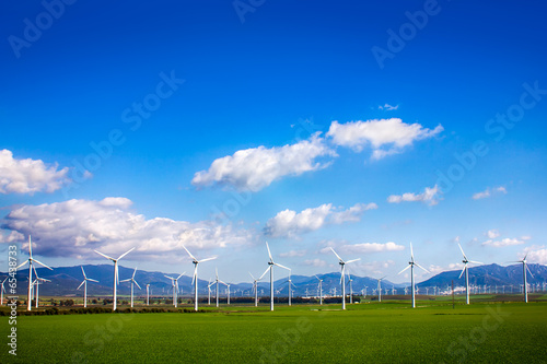 Windmills on green meadow. Spain photo