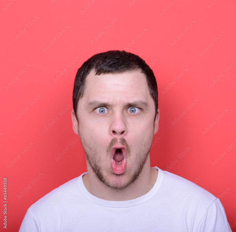 Portrait of man with funny face against red background Portrait of man with funny face against red background
