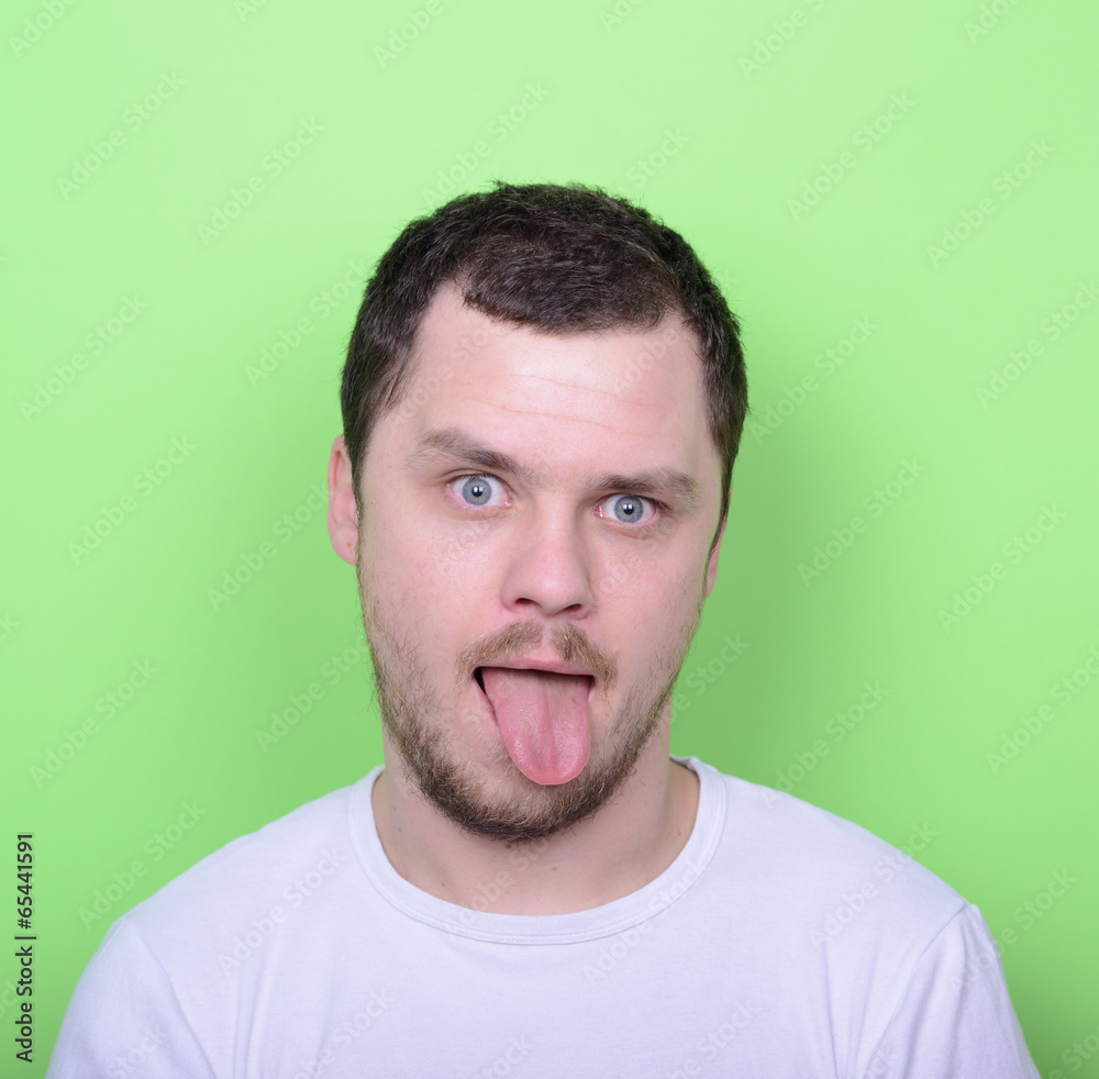 Portrait of man with funny face against green background Portrait of man with funny face against green background