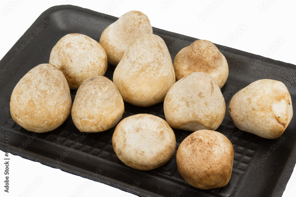 Fototapeta premium Straw Mushroom in foam pack, isolated on white background