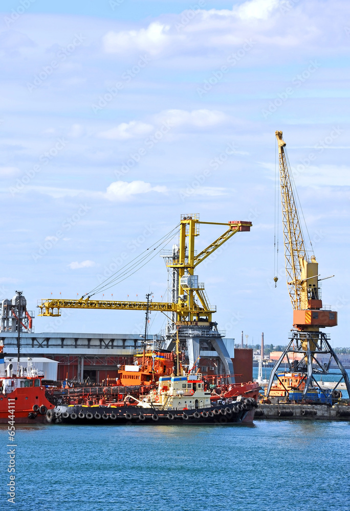 Bunker ship and tugboat under port crane, Odessa, Ukraine
