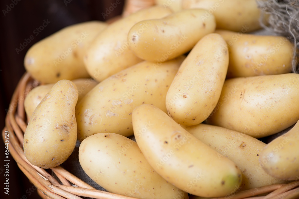Close-up of raw potato in a basket, horizontal shot Close-up of raw potato in a basket, horizontal shot